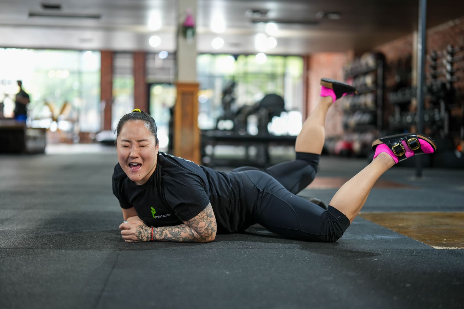 Persistence Athletics member laughing during a mobility drill, Belltown Seattle