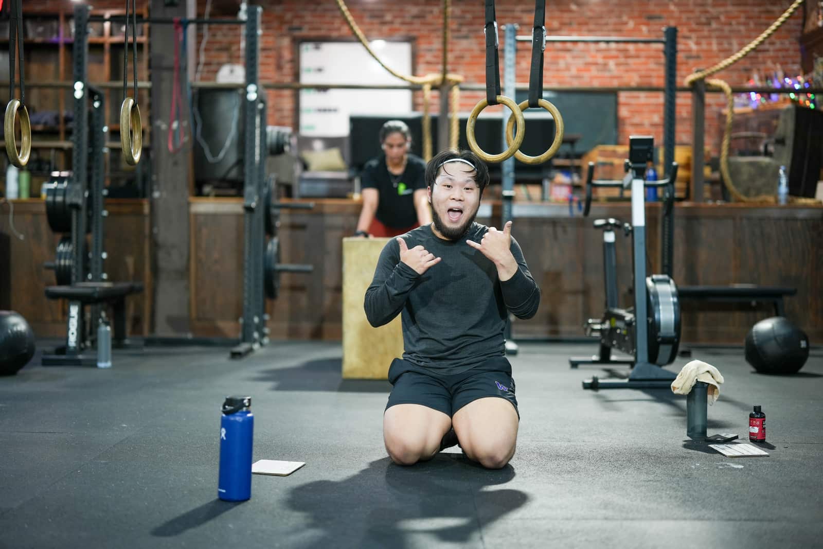 Member laughing during a class break at Persistence Athletics, Belltown Seattle