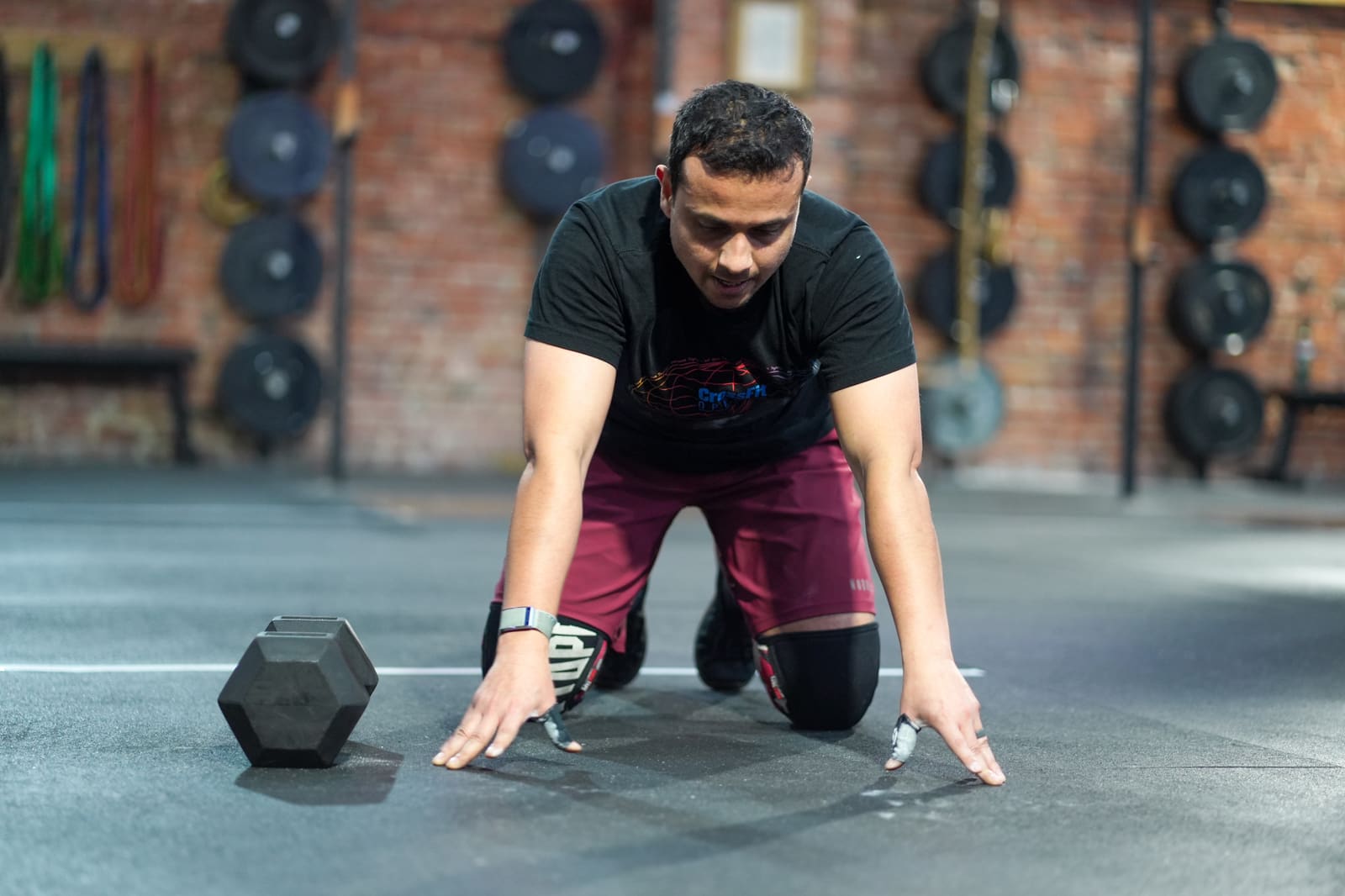Member resetting between rounds during a CrossFit class at Persistence Athletics, Belltown Seattle