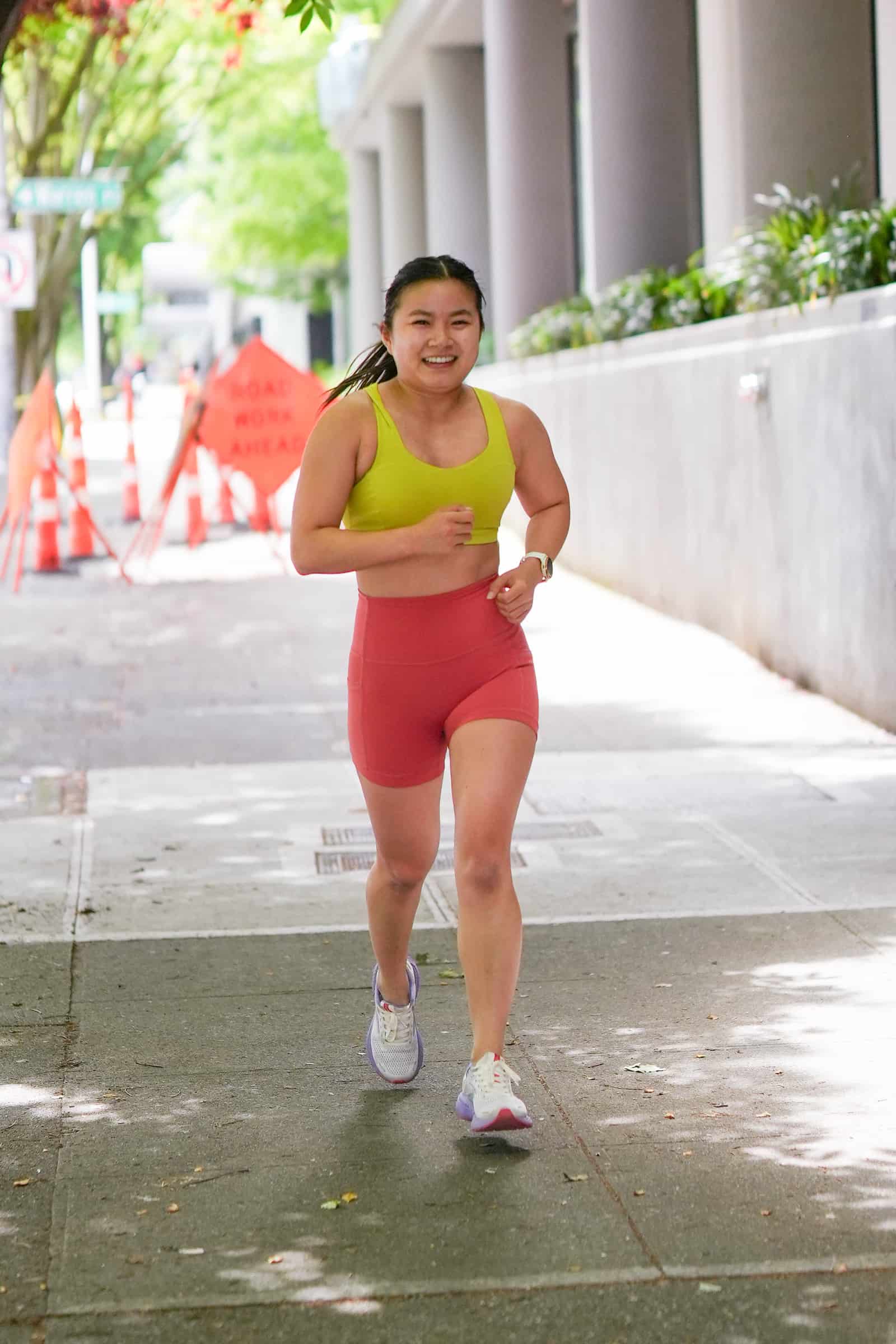 Member running outside on 1st Ave at Persistence Athletics, Belltown Seattle