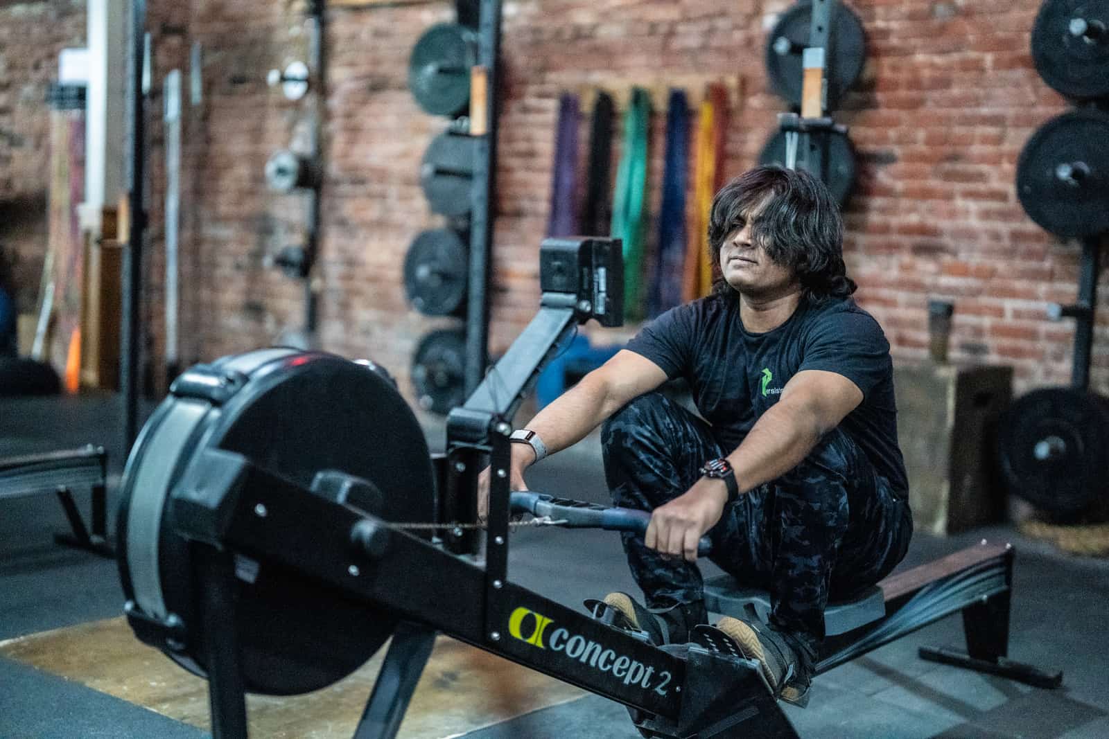 Member smiling after a coached lift at Persistence Athletics, Belltown Seattle