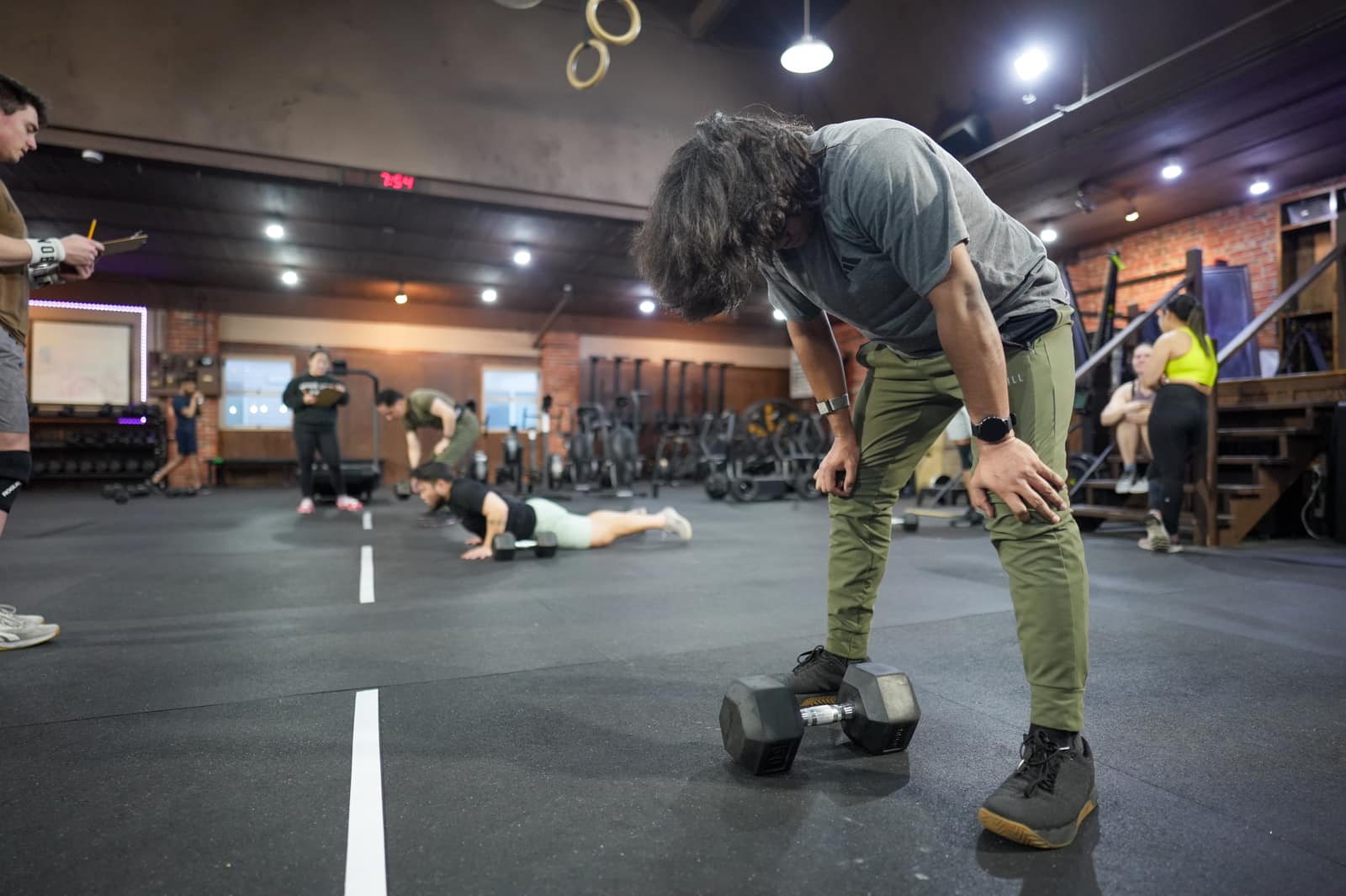 Member mid-set during a strength class at Persistence Athletics, Belltown Seattle
